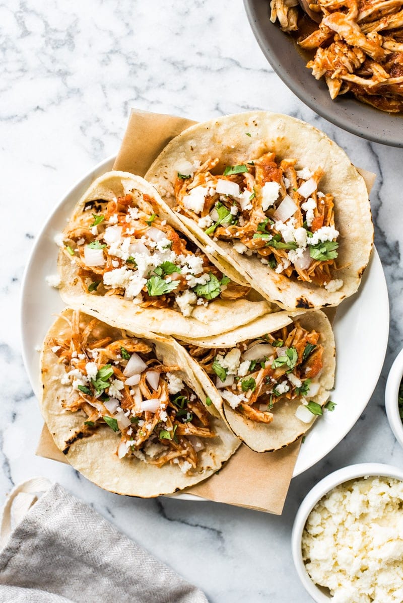These Easy Chicken Tinga Tacos feature shredded chicken in a smoky chipotle sauce that's ready in only 30 minutes! (gluten free, low carb, paleo)