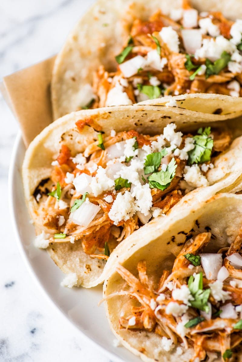 These Easy Chicken Tinga Tacos feature shredded chicken in a smoky chipotle sauce that's ready in only 30 minutes! (gluten free, low carb, paleo)