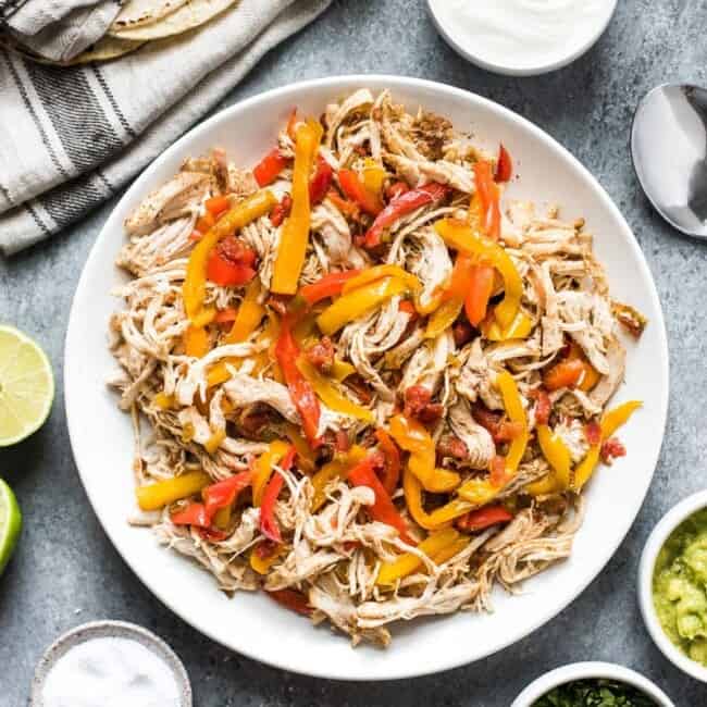 These easy crockpot chicken fajitas are made with only 6 ingredients! Serve in tacos for a weeknight meal or in burrito bowls and salads for a healthy lunch! (gluten free, paleo, low carb)