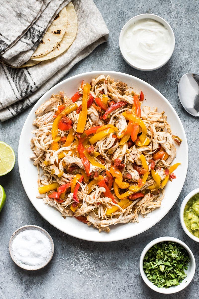 These easy crockpot chicken fajitas are made with only 6 ingredients! Serve in tacos for a weeknight meal or in burrito bowls and salads for a healthy lunch! (gluten free, paleo, low carb)