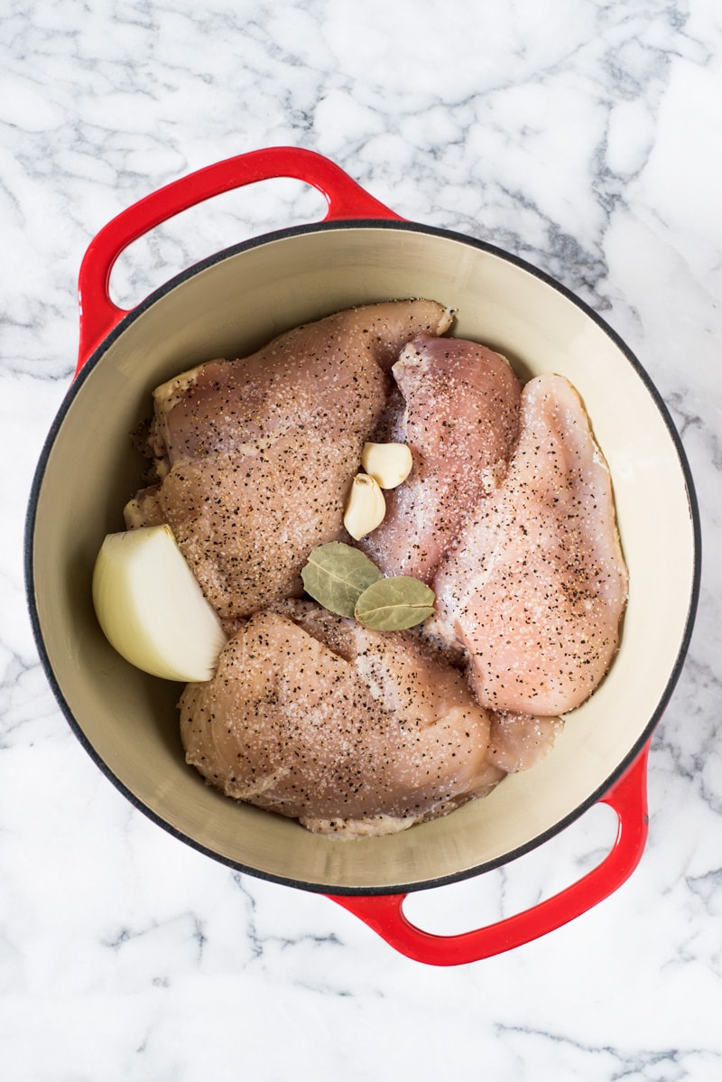 An Easy Shredded Chicken recipe that makes juicy, flavorful and tender chicken every time. Use it in omelets, salads, tacos, nachos, soups, rice bowls, burritos, enchiladas and more!