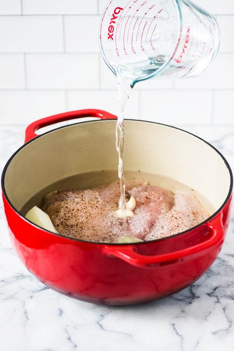 An Easy Shredded Chicken recipe that makes juicy, flavorful and tender chicken every time. Use it in omelets, salads, tacos, nachos, soups, rice bowls, burritos, enchiladas and more!