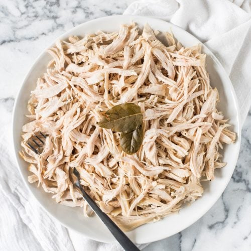 An Easy Shredded Chicken recipe that makes juicy, flavorful and tender chicken every time on the stove top. Use it in omelets, salads, tacos, nachos, soups, rice bowls, burritos, enchiladas and more!