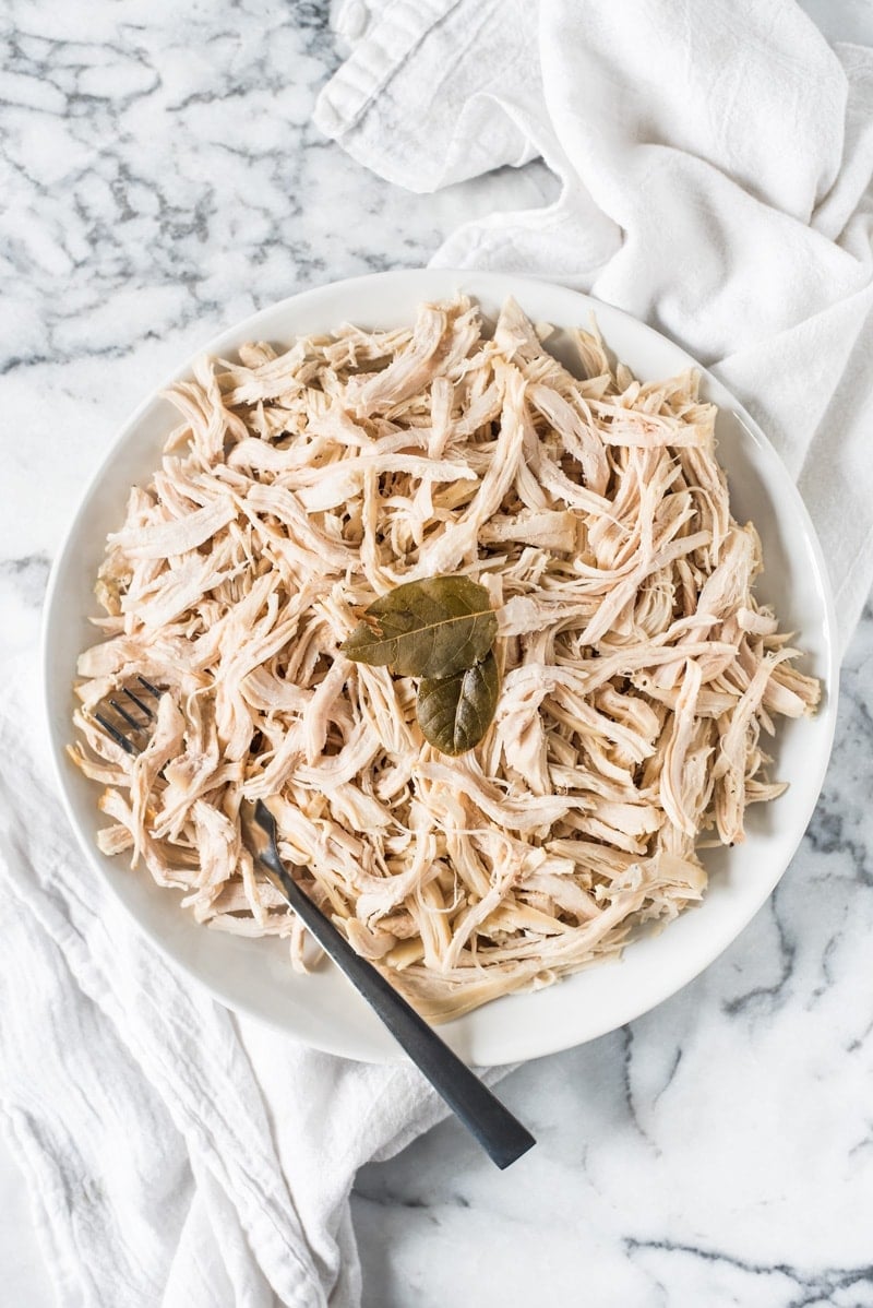 An Easy Shredded Chicken recipe that makes juicy, flavorful and tender chicken every time. Use it in omelets, salads, tacos, nachos, soups, rice bowls, burritos, enchiladas and more!