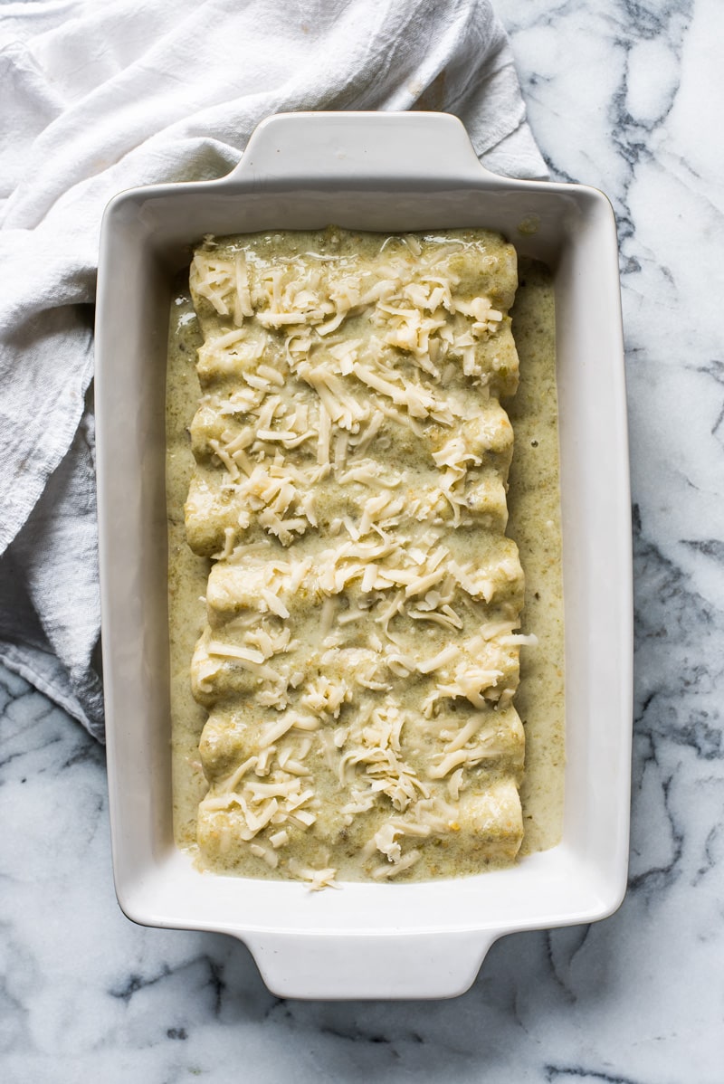 Enchiladas Suizas - enchiladas filled with shredded chicken and cheese and covered with an addicting salsa verde cream sauce. Simply the best!