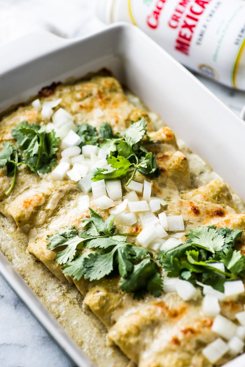 Enchiladas Suizas - enchiladas filled with shredded chicken and cheese and covered with an addicting salsa verde cream sauce. Simply the best!