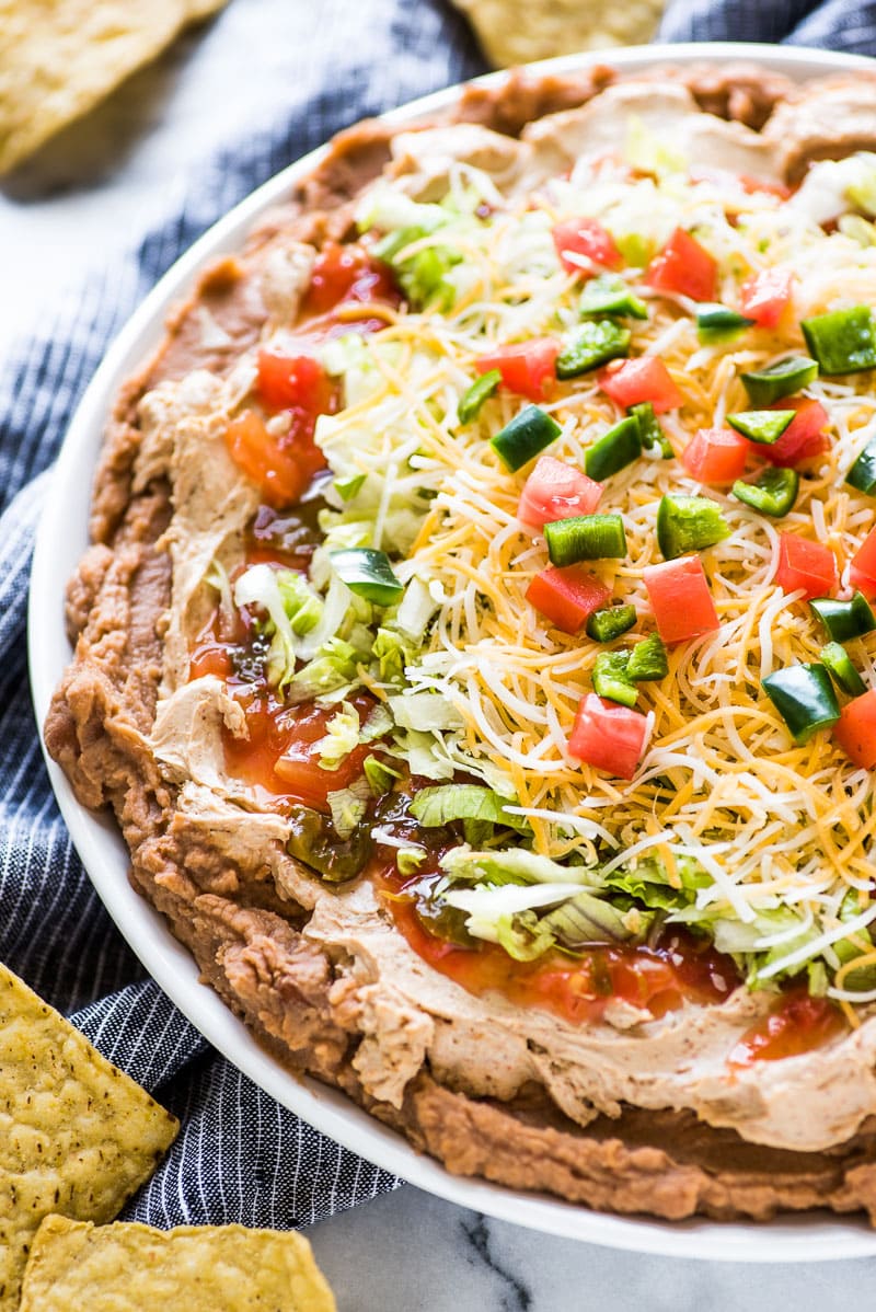 Taco dip made with refried pinto beans.