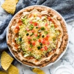 This Healthy Taco Dip made with 5 layers of delicious ingredients is ready in under 10 minutes and is the perfect appetizer for any party!