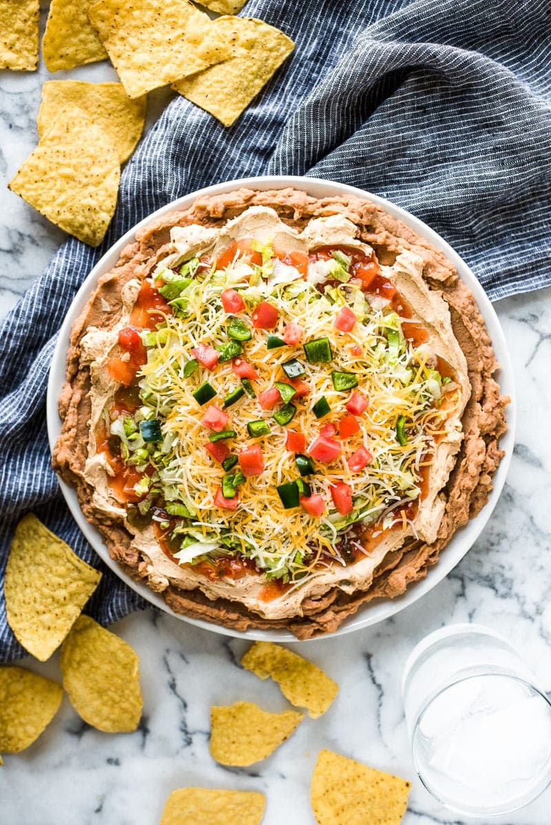 This layered Taco Dip is healthy, ready in under 10 minutes and is the perfect appetizer for any party!