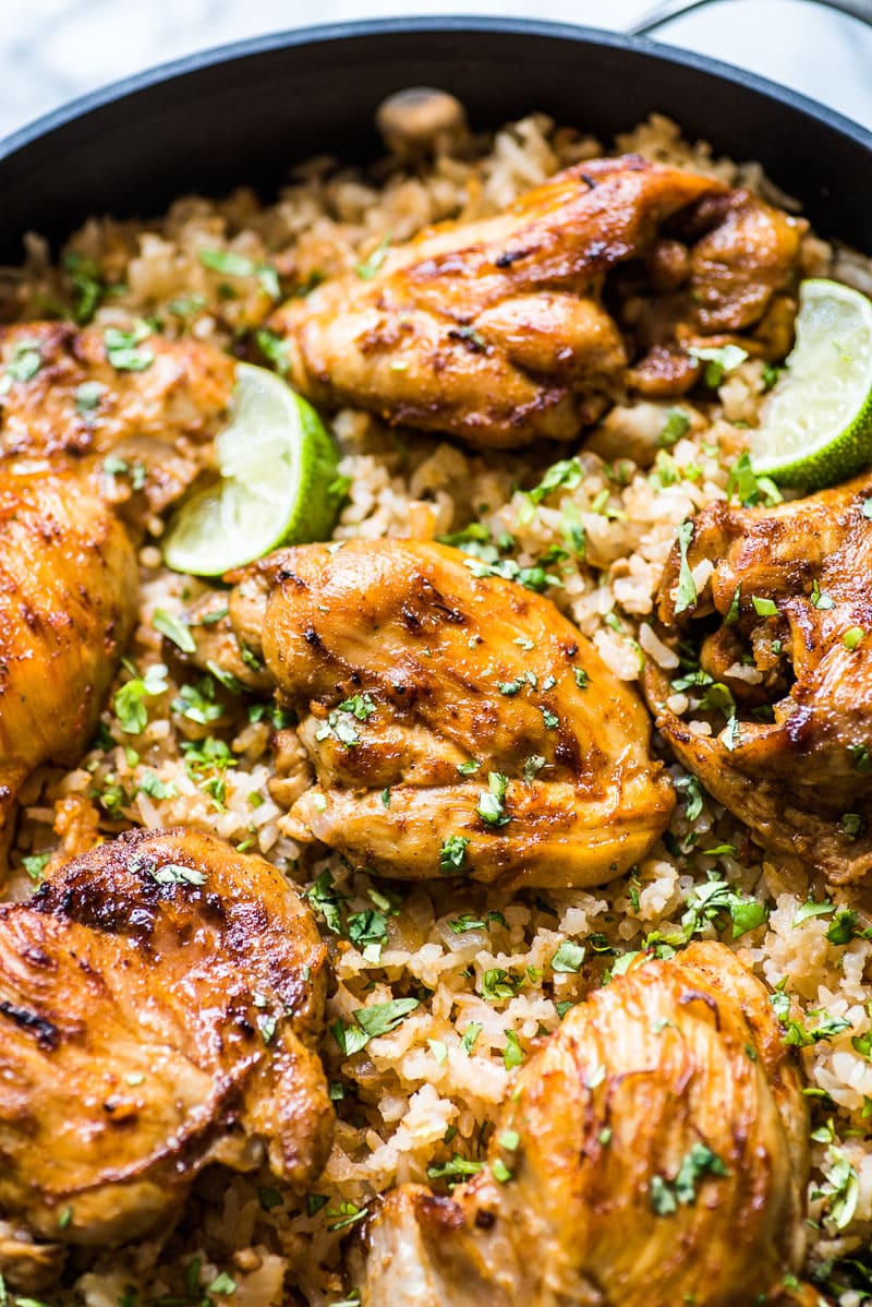 This Mexican Chicken and Rice recipe features tender, juicy marinated chicken thighs and authentic Mexican rice cooked all in one pot!