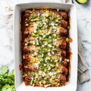 This Red Chicken Enchiladas recipe makes the BEST DINNER EVER! They're stuffed with shredded chicken and cheese, topped with red enchilada sauce and baked for 20 minutes.