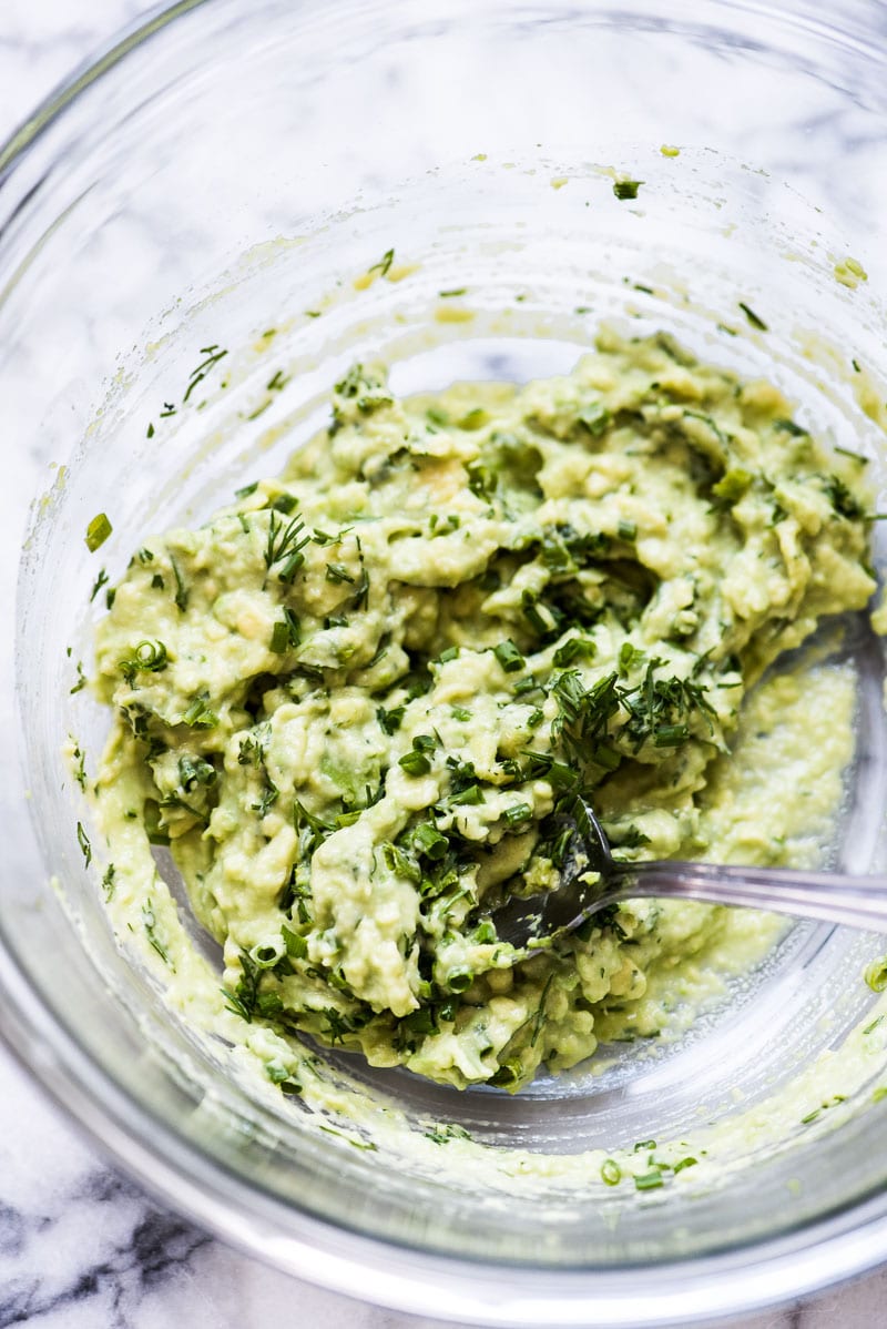 Smashed avocados with dill and chives for avocado egg salad.