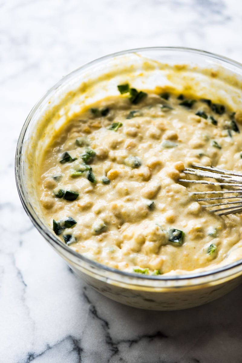 This Green Chile Jiffy Corn Casserole is made with whole kernel corn, creamed corn and a box of corn muffin mix. It's one of the easiest recipes you'll make this holiday season!