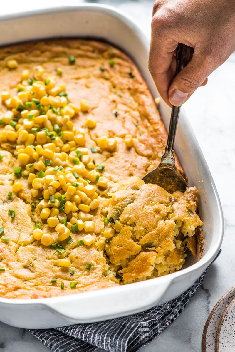 This Green Chile Corn Casserole is made with whole kernel corn, creamed corn and a box of corn muffin mix. It's one of the easiest recipes you'll make this holiday season!