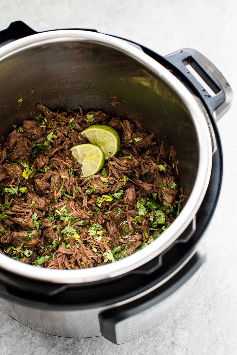 This moist and tender Mexican Shredded Beef is made in the Instant Pot in less than 2 hours! Its delicious by itself or great in tacos, salads and more.