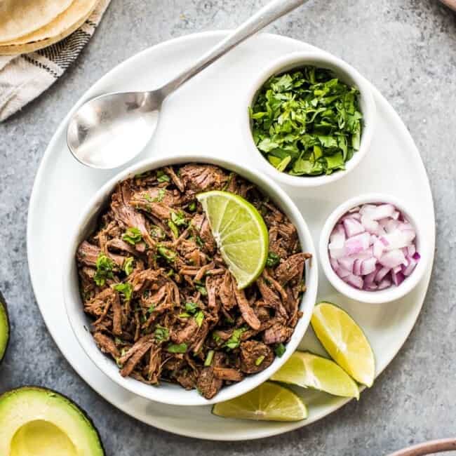This moist and tender Mexican Shredded Beef is made in the Instant Pot in less than 2 hours! Its delicious by itself or great in tacos, salads and more.
