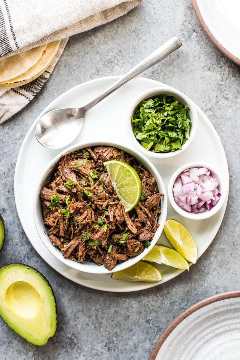 This moist and tender Mexican Shredded Beef is made in the Instant Pot in less than 2 hours! Its delicious by itself or great in tacos, salads and more.