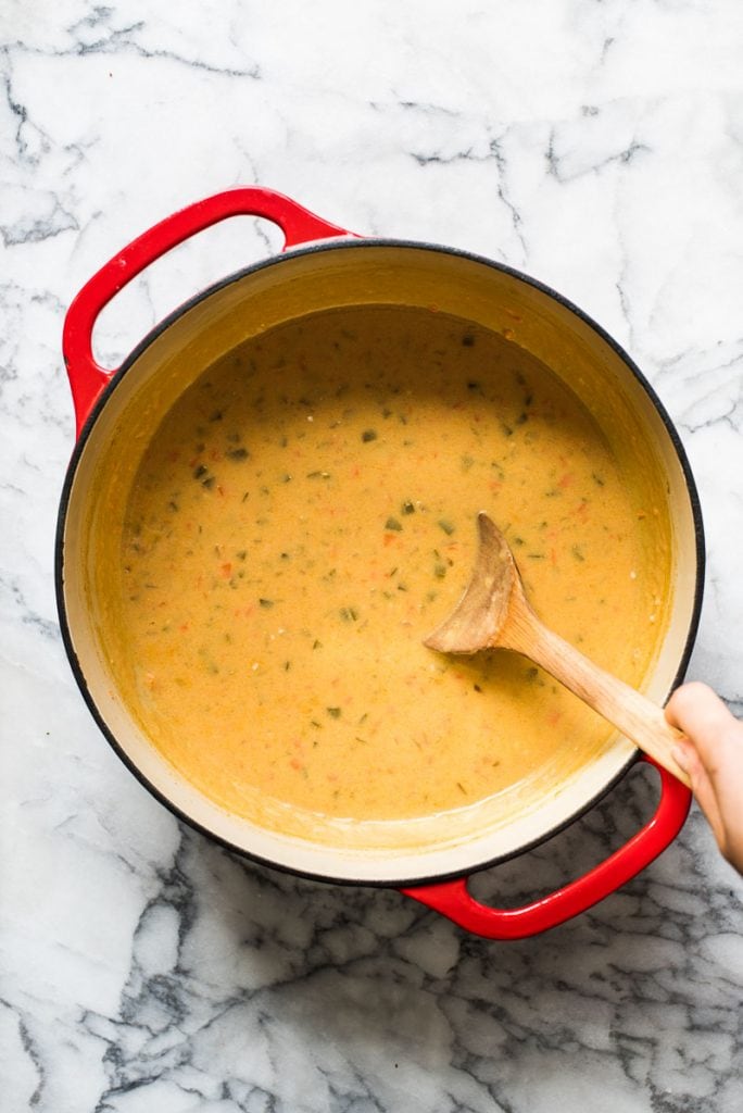 How to make beer cheese soup - keep mixing in the cheese until it's fully melted and velvety smooth