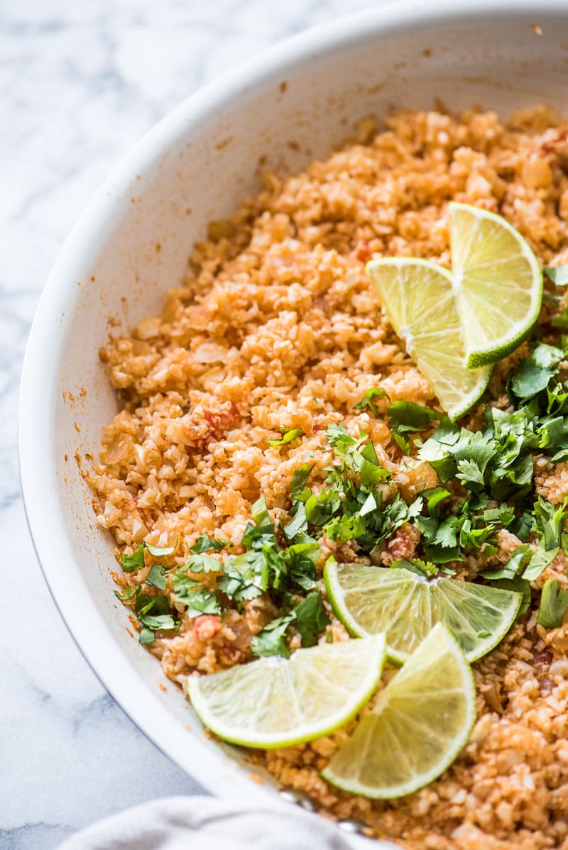 This Mexican Cauliflower Rice is a delicious and healthy low-carb alternative to traditional Mexican rice. It's ready in only 25 minutes and is gluten free, paleo, vegetarian and vegan.