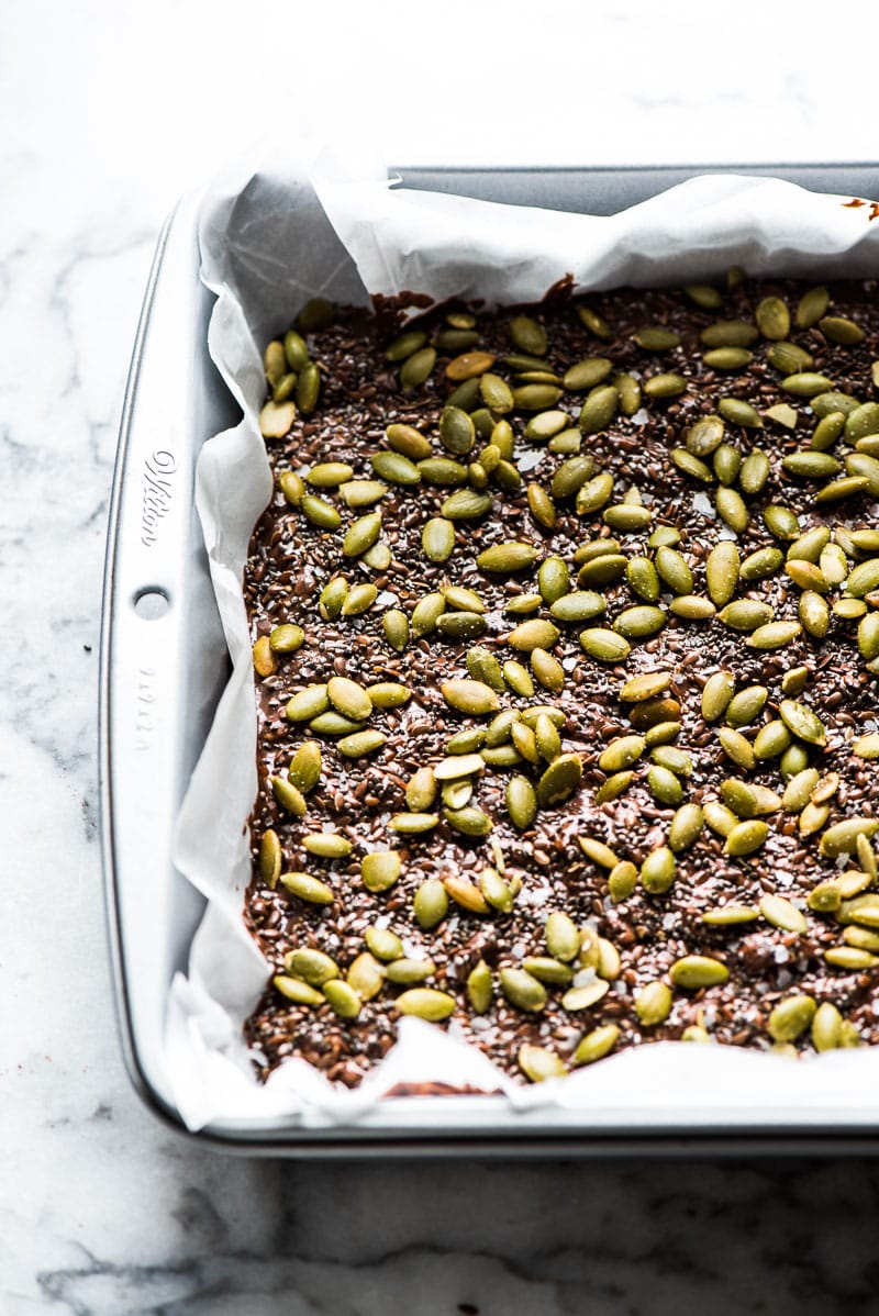Chocolaty, crunchy and easy to make, these No Bake Chocolate Crunch Bars are made with puffed rice cereal, chocolate chips and good-for-you ingredients like pepitas for a delicious treat!