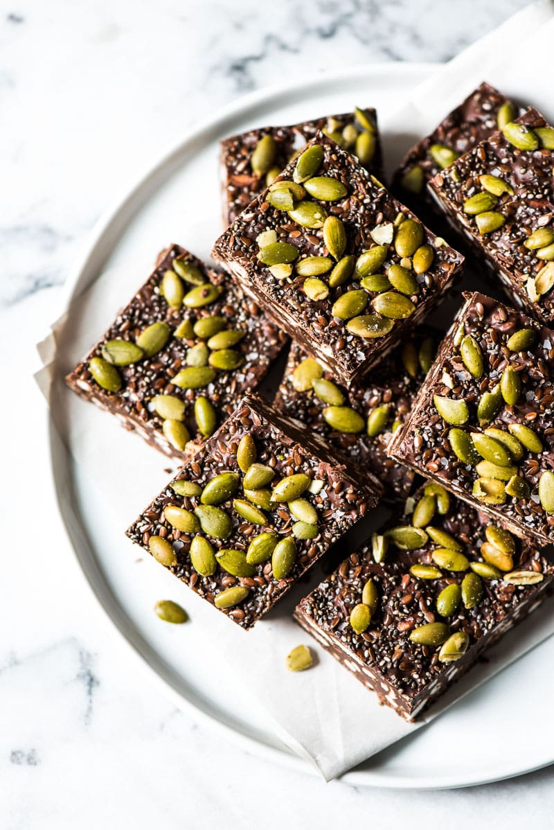 Chocolaty, crunchy and easy to make, these No Bake Chocolate Crunch Bars are made with puffed rice cereal, chocolate chips and good-for-you ingredients like pepitas for a delicious treat!