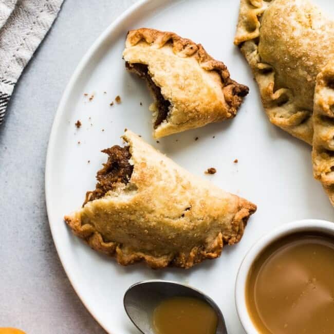 These Easy Pumpkin Empanadas are the perfect handheld fall and winter treat stuffed with a delicious pumpkin filling and wrapped in a sweet pastry dough. They're baked, not fried!