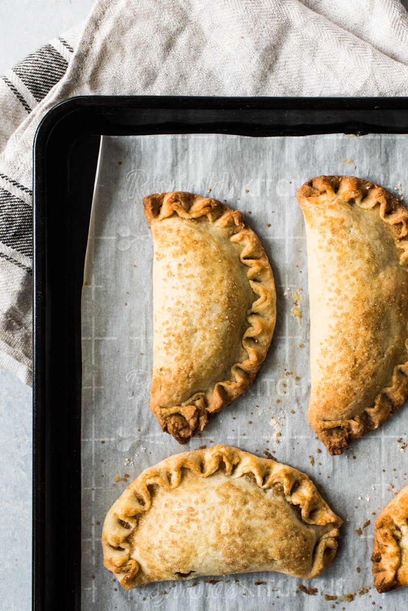 These Easy Pumpkin Empanadas are the perfect handheld fall and winter treat stuffed with a delicious pumpkin filling and wrapped in a sweet pastry dough. They're baked, not fried!
