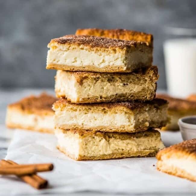 These Sopapilla Cheesecake bars are the perfect combination of light and airy crescent roll dough, creamy cheesecake filling and cinnamon sugar topping!