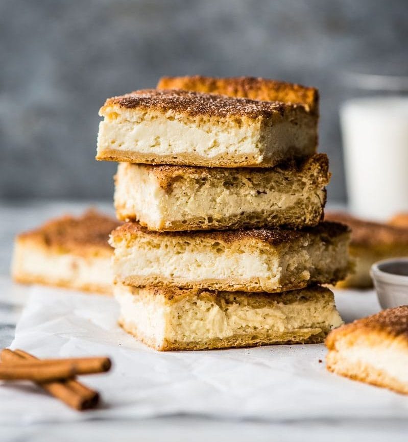 These Sopapilla Cheesecake bars are the perfect combination of light and airy crescent roll dough, creamy cheesecake filling and cinnamon sugar topping!