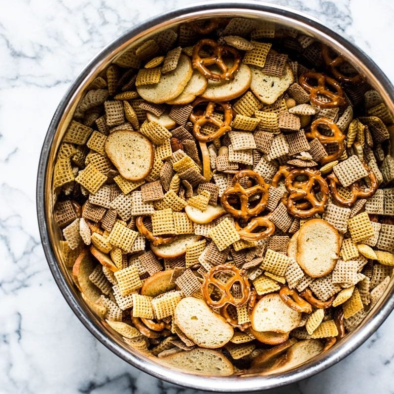 This Chex Party Mix recipe is easy to make and brings together all the crunchy, salty and delicious buttery flavors with a hint of smoky spicy goodness! It's the perfect snack for sharing!