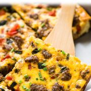 This Tex Mex Sausage Breakfast Casserole is made with crescent roll dough, breakfast sausage, peppers and onions. It's perfect for brunch and can be made ahead of time!