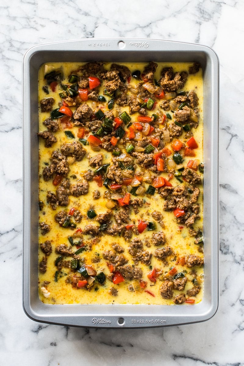 This Easy Sausage Breakfast Casserole is made with crescent roll dough, breakfast sausage, peppers and onions. It's perfect for brunch and can be made ahead of time!