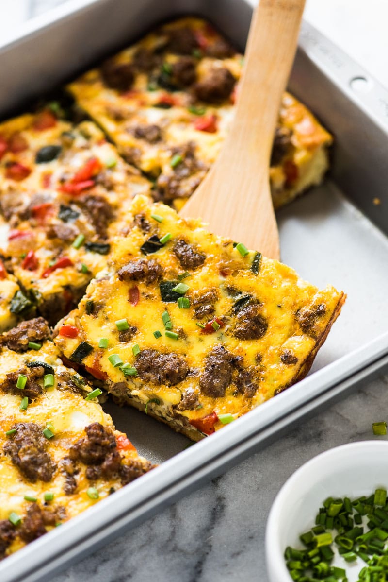 This Tex Mex Sausage Breakfast Casserole is made with crescent roll dough, breakfast sausage, peppers and onions. It's perfect for brunch and can be made ahead of time!