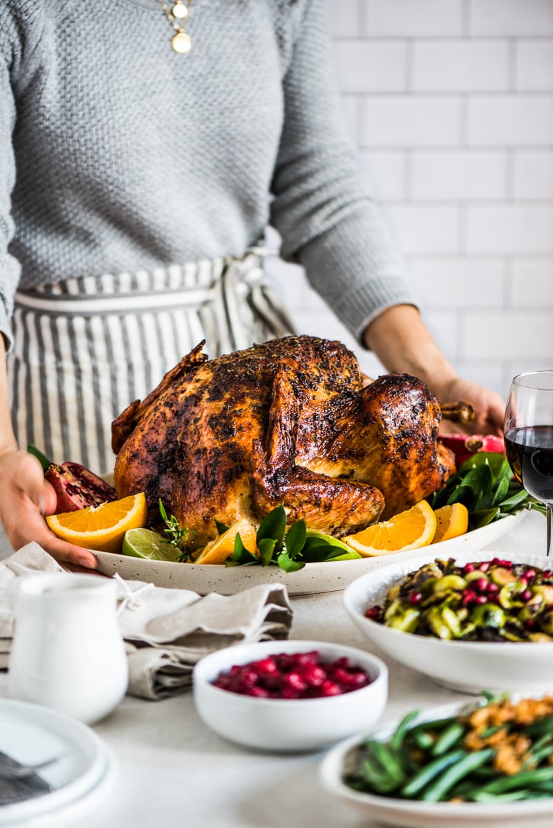 Thanksgiving turkey on a table next thanksgiving sides.