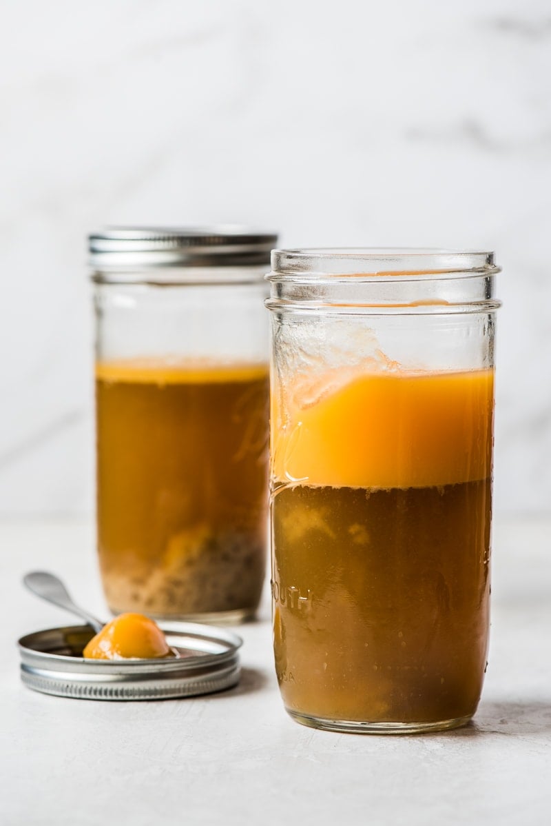 Turkey gravy from drippings in a jar with the fat and liquid separated.