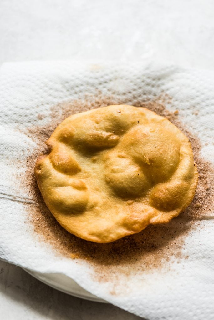 Often served during the Christmas and New Years holidays, this Mexican Bunuelos recipe makes the perfect fried dough covered in cinnamon sugar!