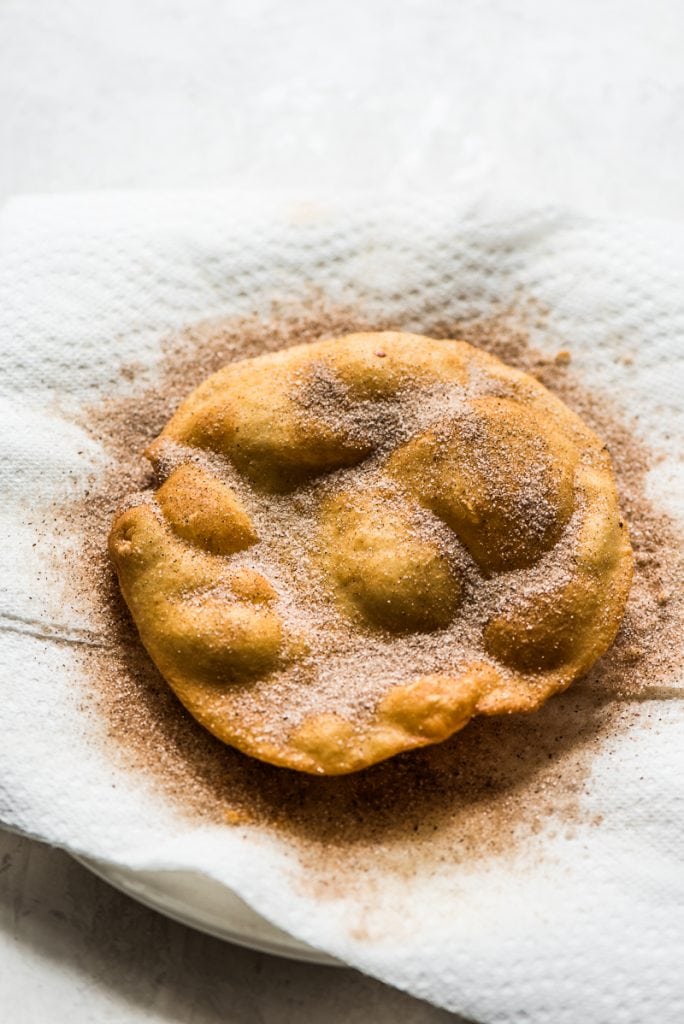 Often served during the Christmas and New Years holidays, this Mexican Bunuelos recipe makes the perfect fried dough covered in cinnamon sugar!