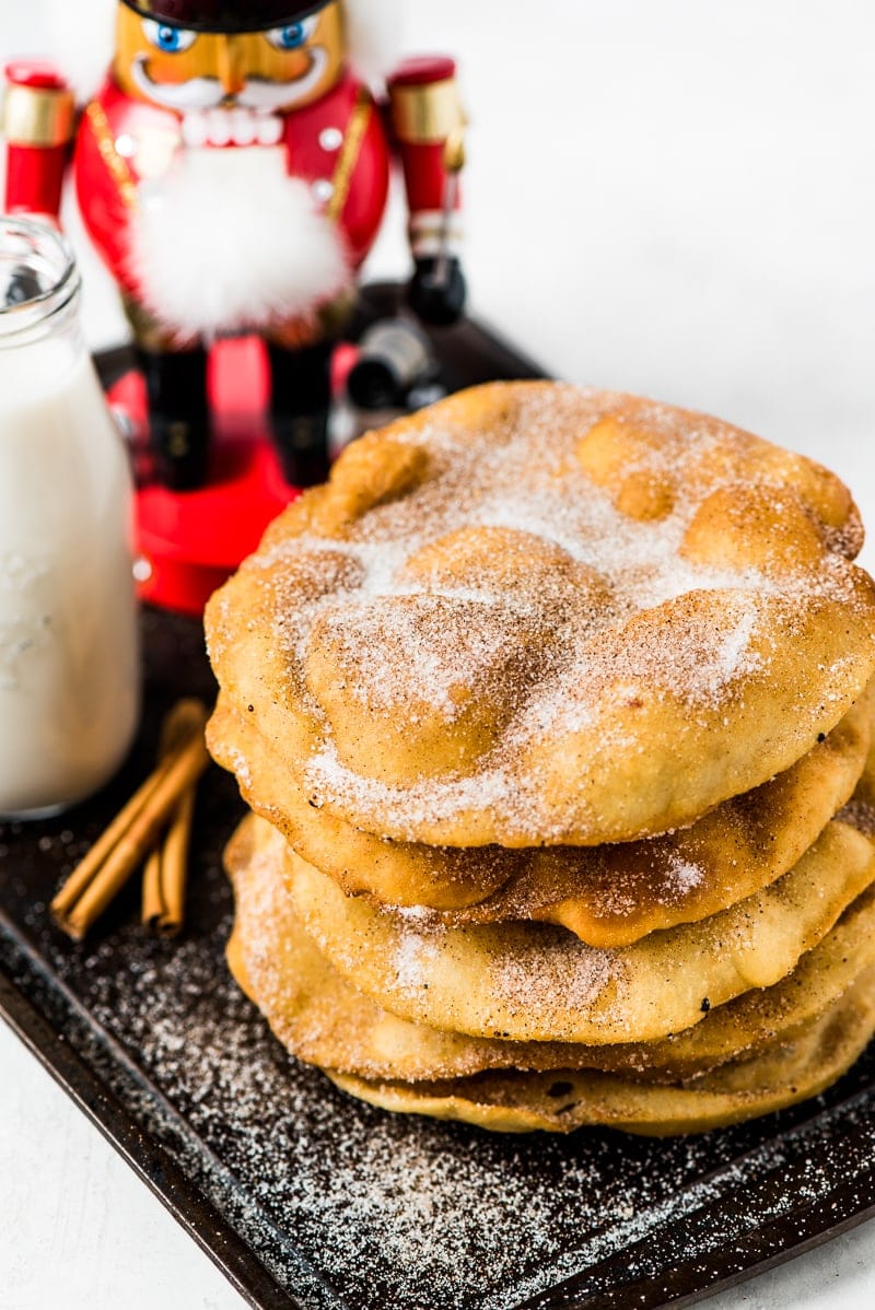 Often served during the Christmas and New Years holidays, this Mexican Bunuelos recipe makes the perfect fried dough covered in cinnamon sugar!