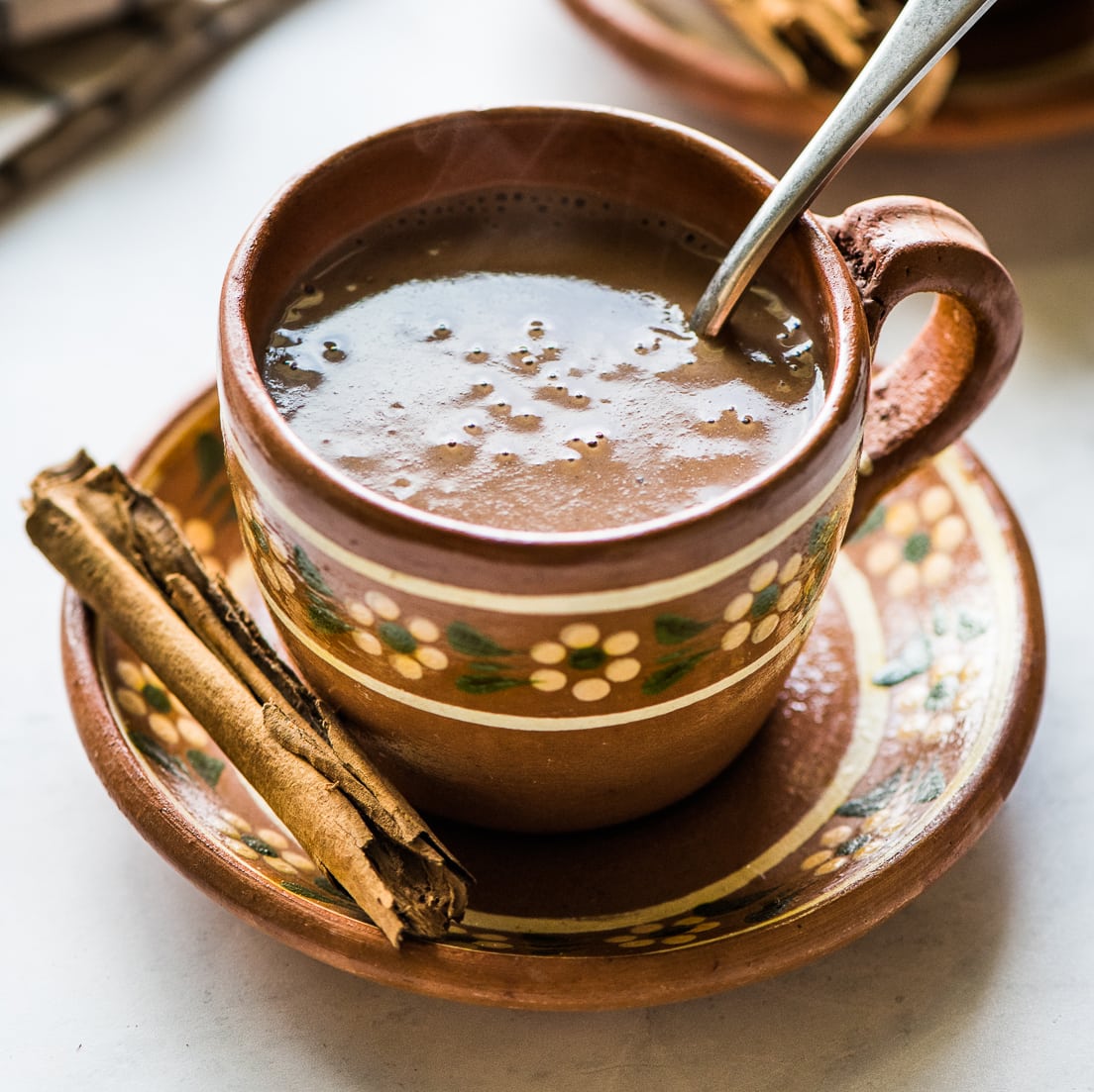 Champurrado in a Mexican clay mug.