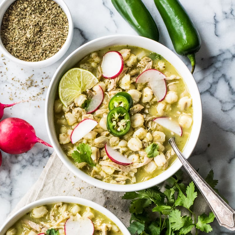 Chicken Pozole Verde - Looking to spice up your holiday menu? These 12 Mexican Christmas food recipes are perfect for celebrating Las Posadas, Noche Buena and Navidad!