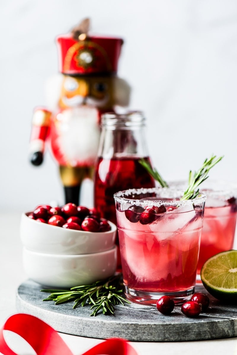 Filled with holiday cheer, this Cranberry Margarita is the perfect Christmas and New Years drink! Made with only 4 simple ingredients, it’s easy to make and comes together in only 5 minutes.