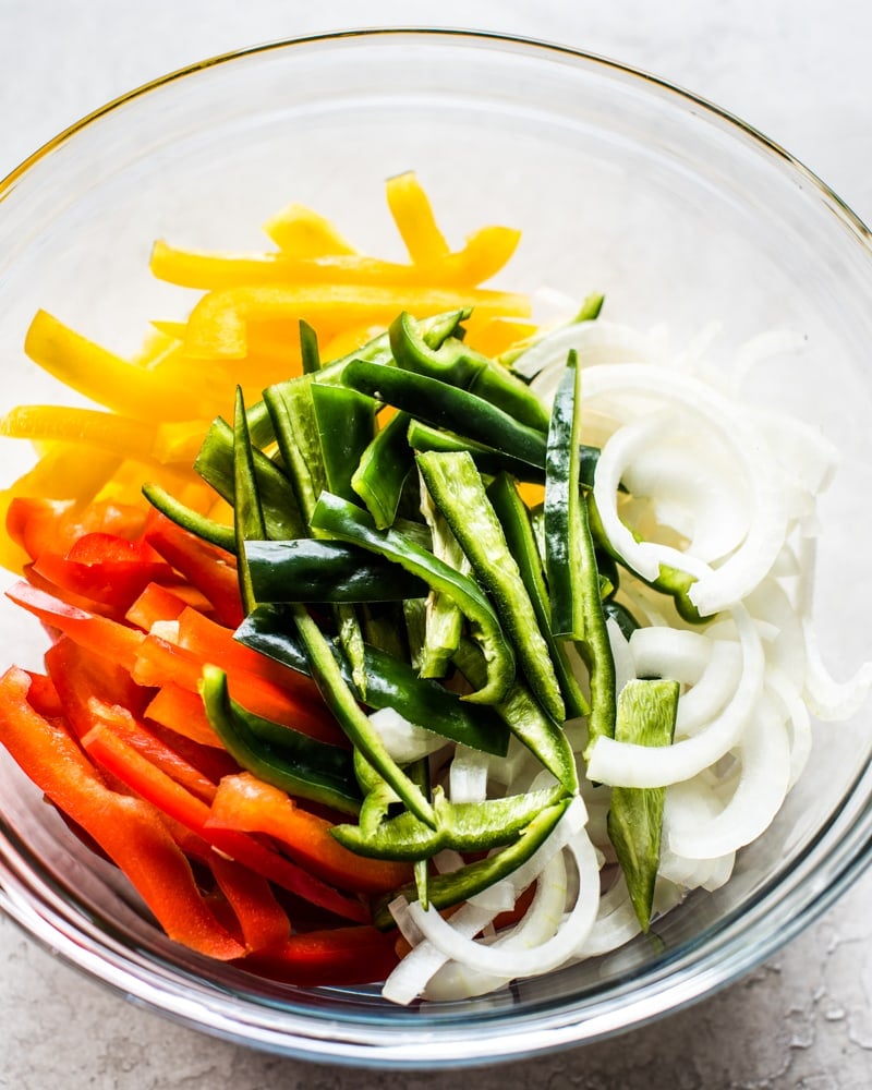 This Healthy Turkey Fajita Bowl recipe is made with delicious cilantro lime cauliflower rice, savory peppers and onions and spicy turkey! (low carb, gluten free, paleo)