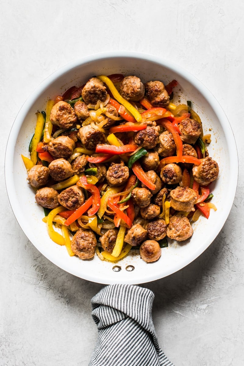 This Healthy Turkey Fajita Rice Bowl recipe is made with delicious cilantro lime cauliflower rice, savory peppers and onions and spicy turkey! (low carb, gluten free, paleo)