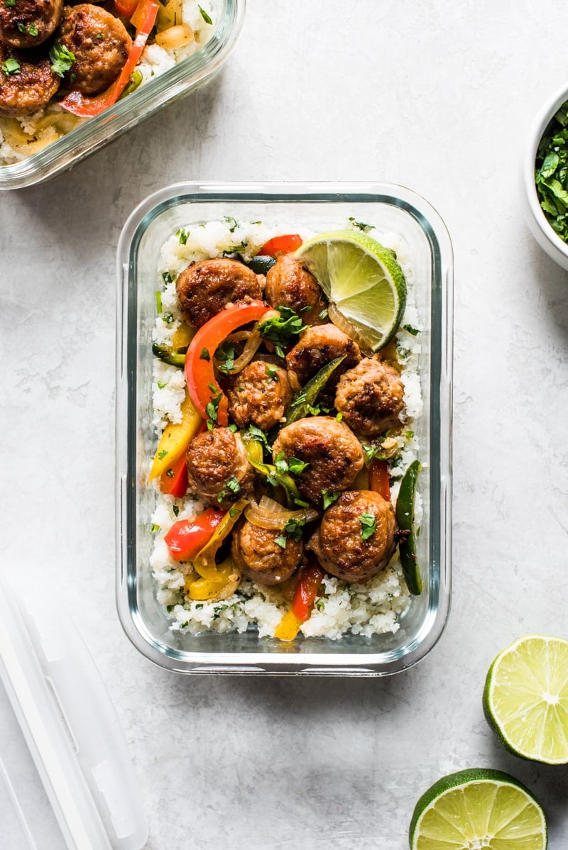 This Healthy Turkey Fajita Rice Bowl recipe is made with delicious cilantro lime cauliflower rice, savory peppers and onions and spicy turkey! It's perfect for meal prepping and freezing! (low carb, gluten free, paleo)