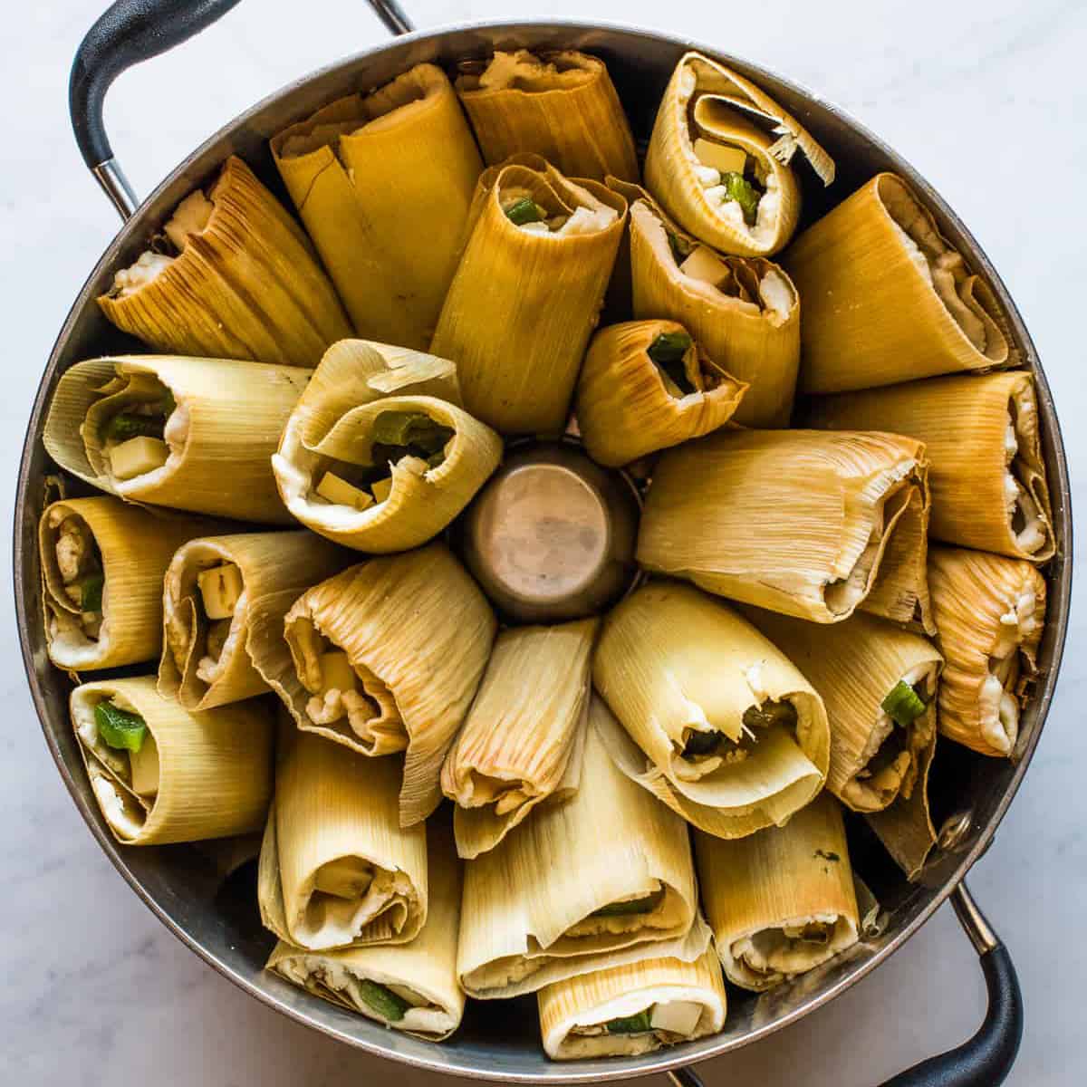 Tamales de Rajas in a steamer pot ready to be steamed.