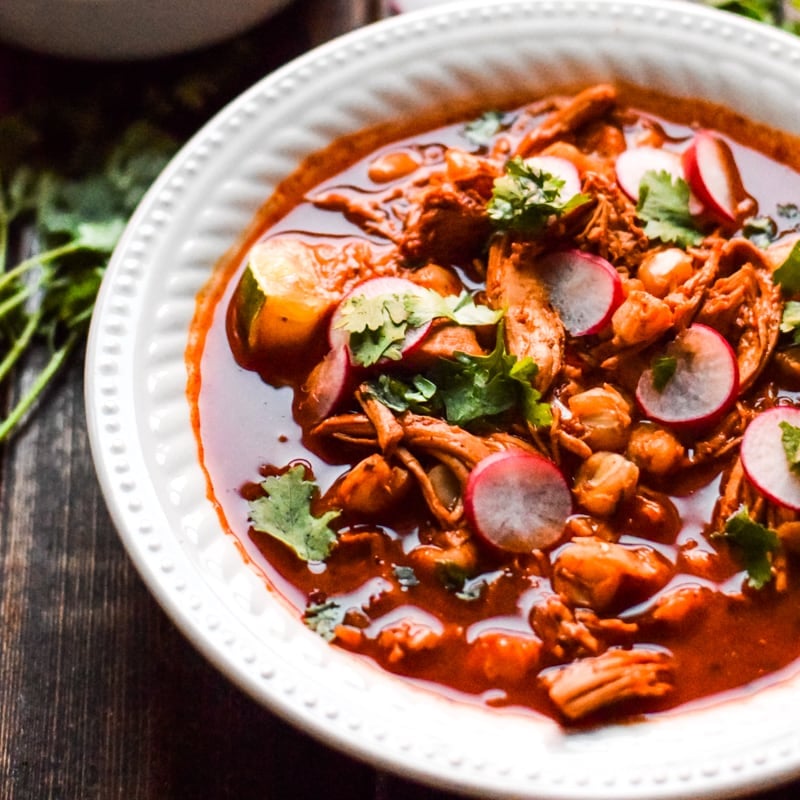 Mexican Slow Cooker Chicken Posole - Looking to spice up your holiday menu? These 12 Mexican Christmas food recipes are perfect for celebrating Las Posadas, Noche Buena and Navidad!