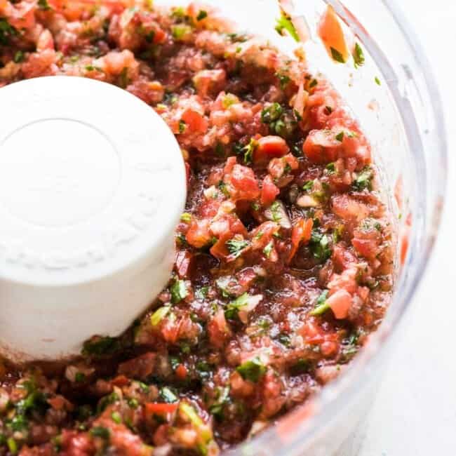 This Homemade Salsa recipe is made with fresh ingredients like tomatoes, onions and cilantro and is ready to eat in only 5 minutes!