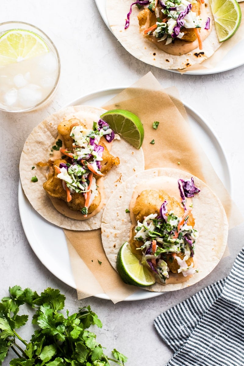 Baja fish tacos on corn tortillas served with chipotle mayo and creamy slaw.