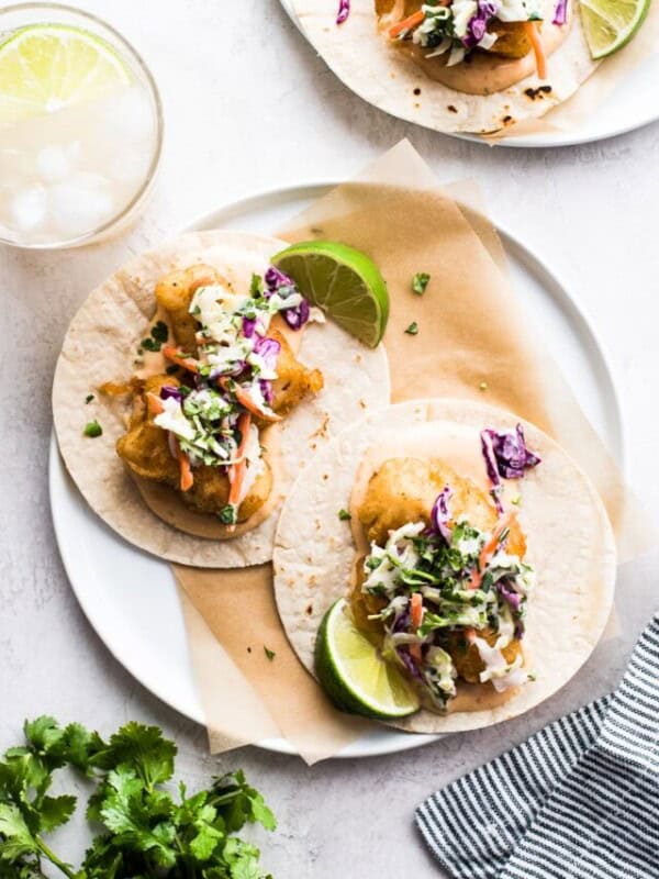 Baja fish tacos on corn tortillas served with chipotle mayo and creamy slaw.