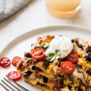 This Easy Taco Casserole (also known as Taco Lasagna) is made with 3 layers of corn tortillas, ground beef, corn, black beans, the best taco seasoning and lots of melted cheese!